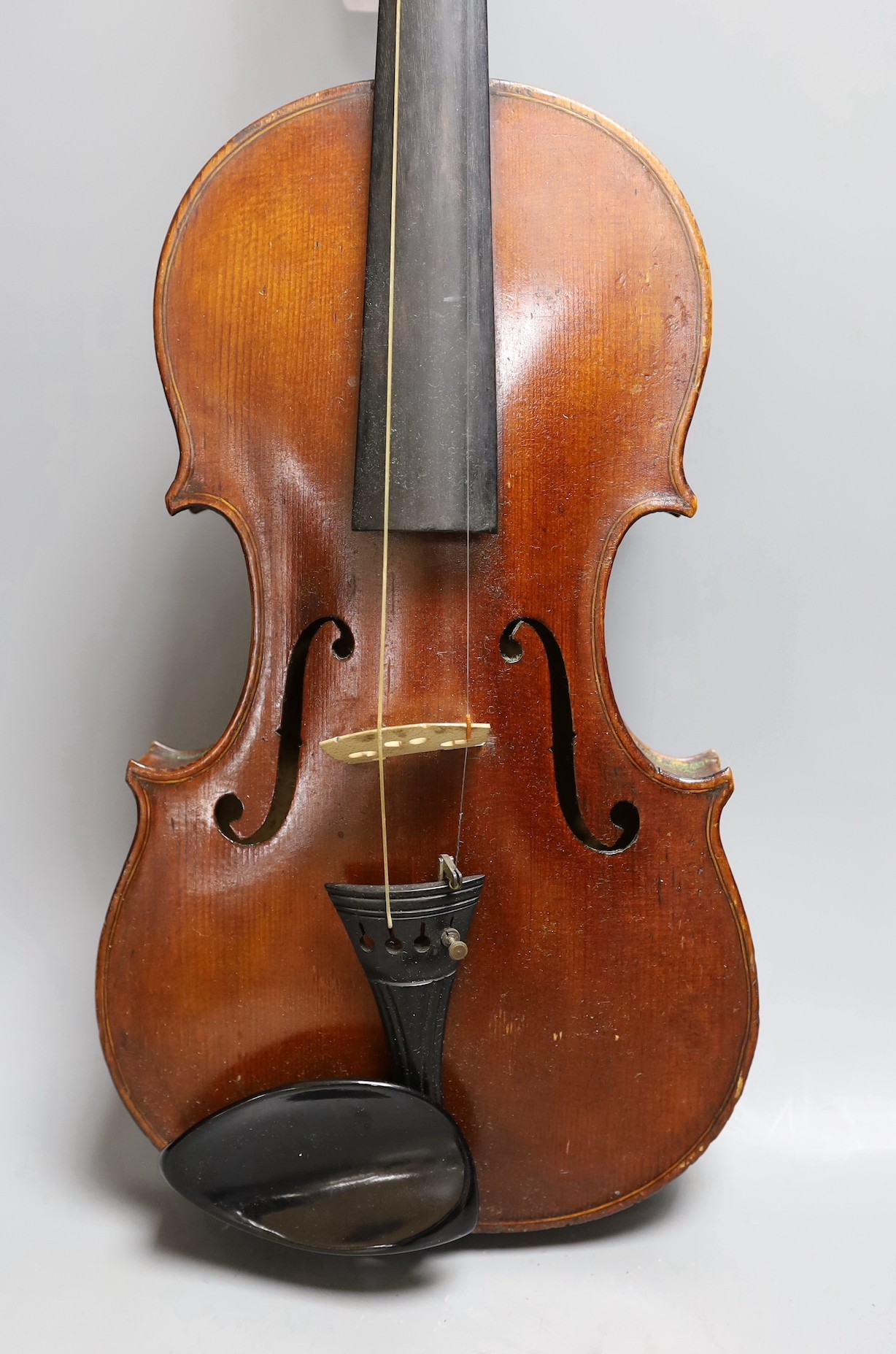 A cased late 19th century English violin, inscribed W. Heaton maker 1887 (?), back measures 35.5cm excl button